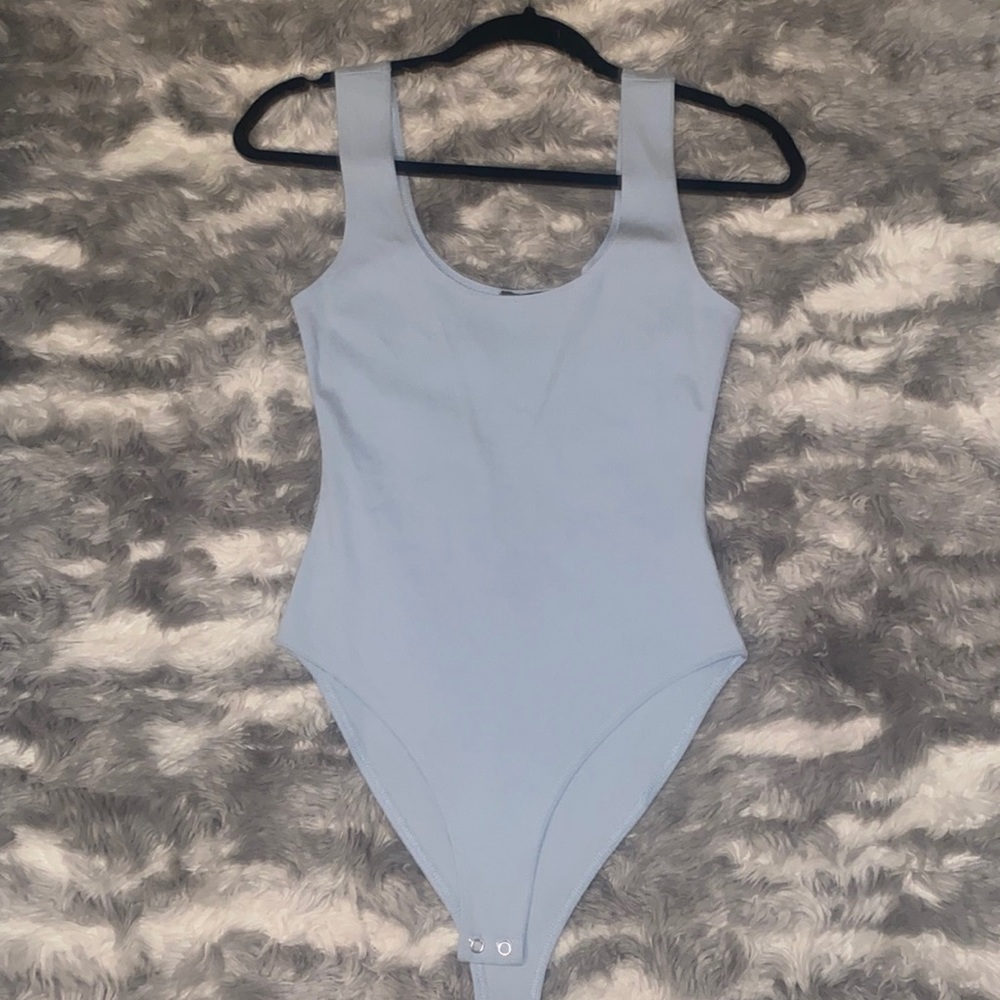 muted blue bodysuit
